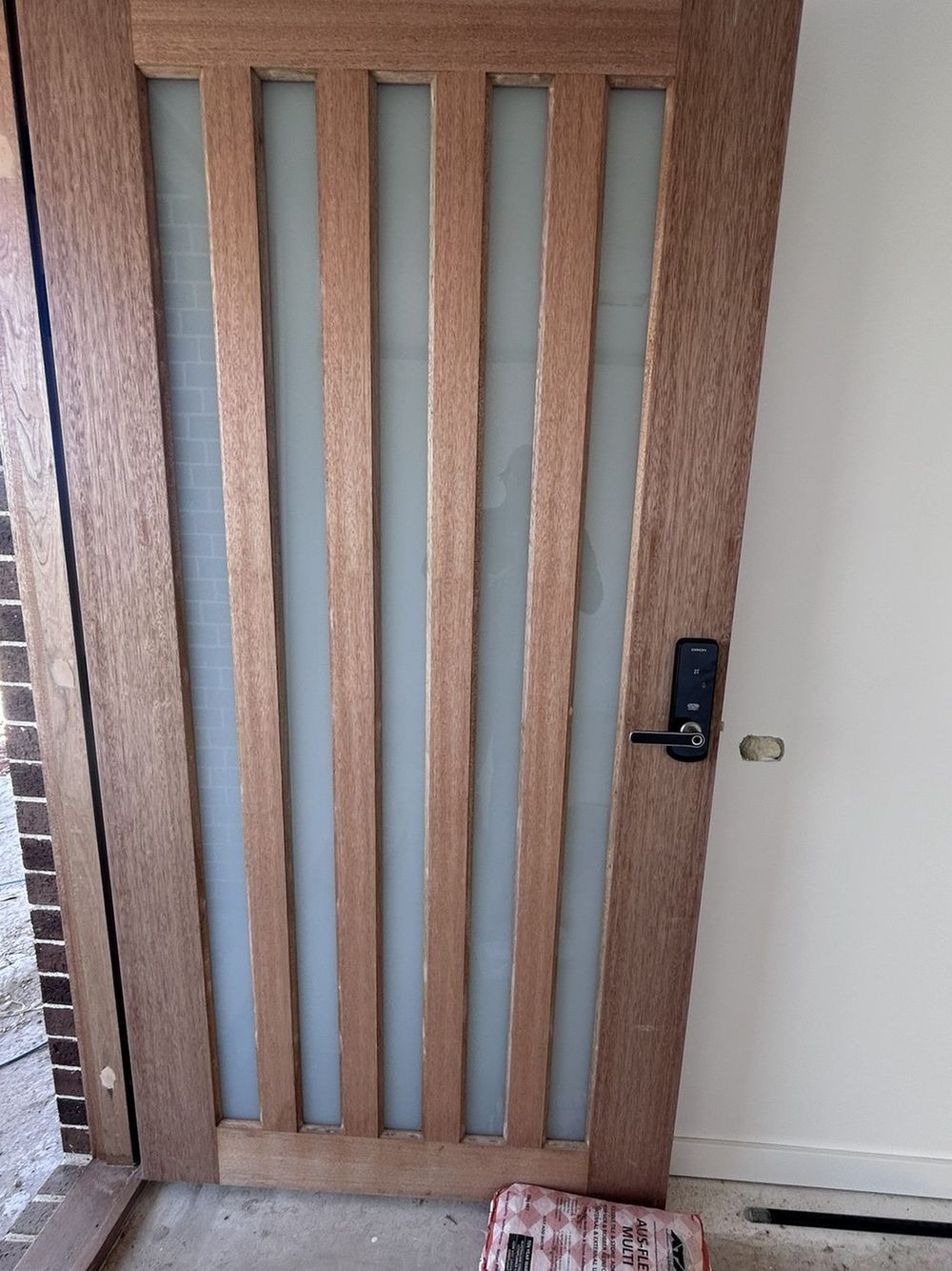 Slat entry door, new home, after